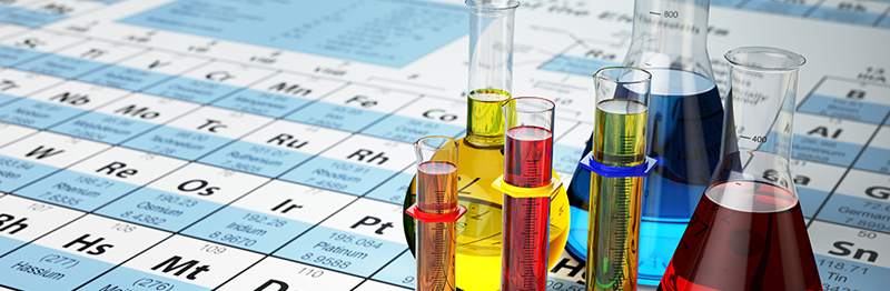 Periodic table with beakers filled with fluid