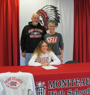 Baily Trettel and family at signing table