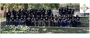 Group of students outside in black t-shirts posing for a picture - Ki Charter San Marcos 21-22