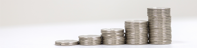 Five stacks of coins lined up next to each other