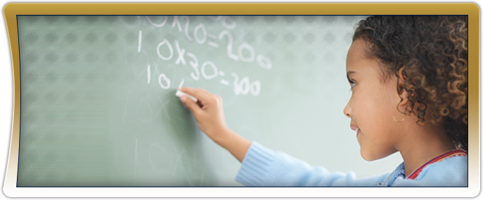 Female student writing math equations on a chalkboard