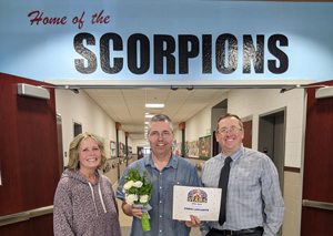 Left to right: Trustee Susan Neal, Chris LaPlante, and Interim Superintendent Clayton Anderson.Chris LaPlante receiving April STARS award