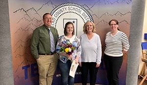 Mrs. Slade accepting award