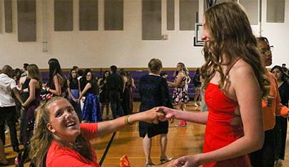 two girls dancing together