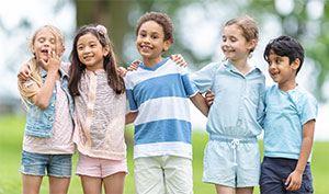 Children hugging outside