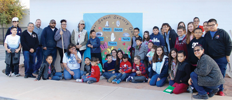 Students and teachers pose together