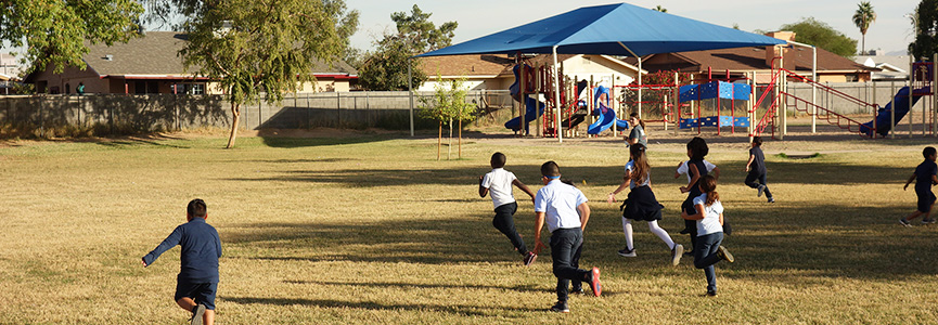 Students running on the playground