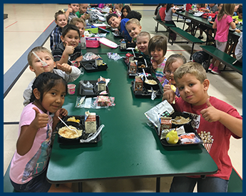 kids eating at lunch table
