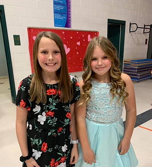 Two girls smiling