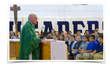 Man speaks to students from behind a podium